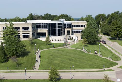 Students are seen coming and going by the exterior of Dempster Hall