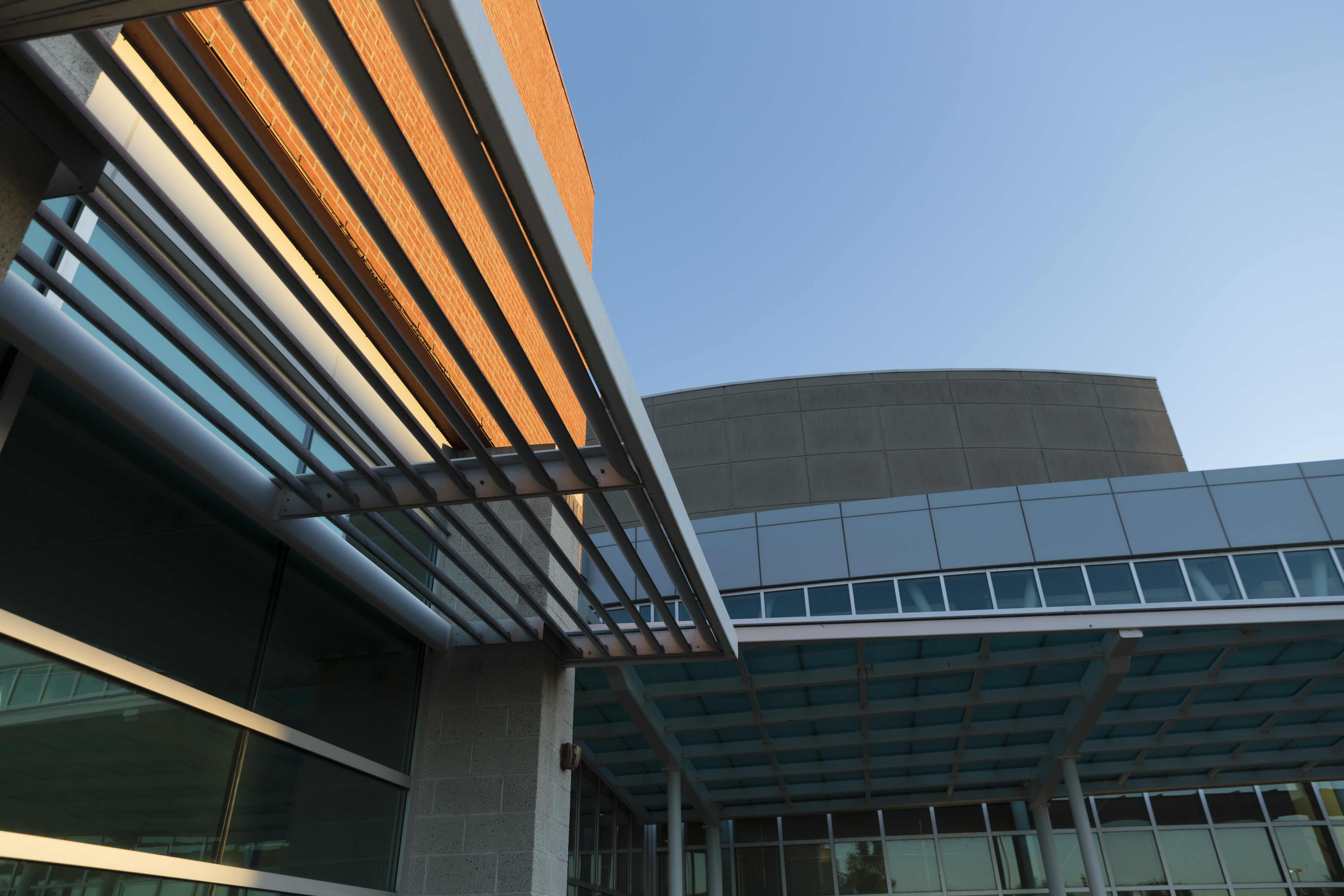 view looking up under the awning to the entrance of the River Campus Cultural Arts Center