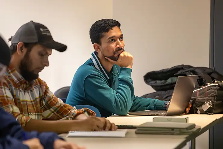 eCTF Cybersecurity Competition team captains and cybersecurity master's students Sartaj Chowdury and Uzair Hussain in class at SEMO.